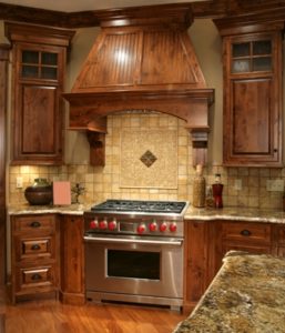 Custom residential kitchen with granite countertops and custom cabinetry.
